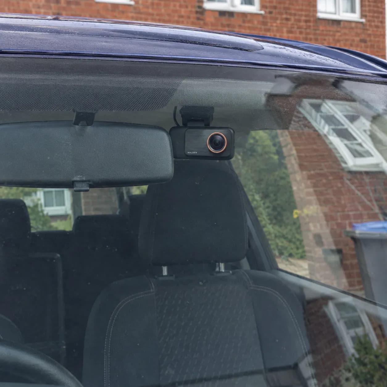 Donna's son's car with the Halden behind the mirror